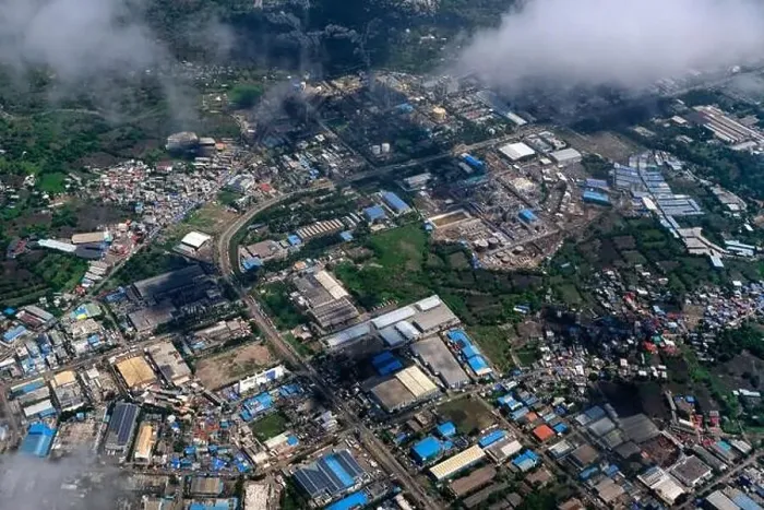 Framed Print : An aerial view of Mumbai's skyline passing over a building with roads and bridges Framed Print : An aerial view of Mumbai's skyline passing over a building with roads and bridges
