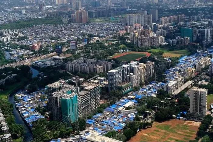 Framed Print : An aerial view of Mumbai's skyline passing over a building with roads and bridges Framed Print : An aerial view of Mumbai's skyline passing over a building with roads and bridges