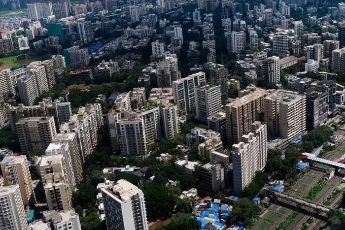 Framed Print : An aerial view of Mumbai's skyline passing over a building with roads and bridges Framed Print : An aerial view of Mumbai's skyline passing over a building with roads and bridges