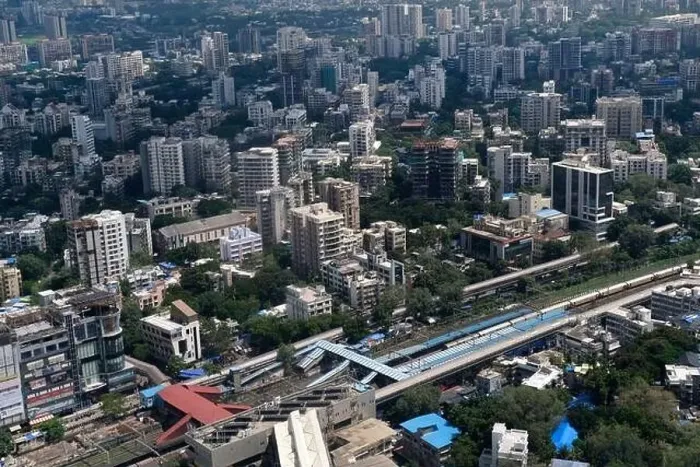 Framed Print : An aerial view of Mumbai's skyline passing over a building with roads and bridges Framed Print : An aerial view of Mumbai's skyline passing over a building with roads and bridges