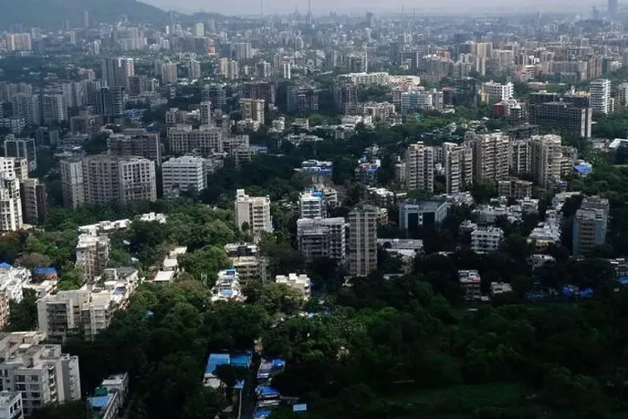 Framed Print : An aerial view of Mumbai's skyline passing over a building with roads and bridges Framed Print : An aerial view of Mumbai's skyline passing over a building with roads and bridges