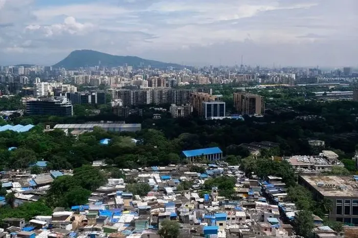 Framed Print : An aerial view of Mumbai's skyline passing over a building with roads and bridges Framed Print : An aerial view of Mumbai's skyline passing over a building with roads and bridges