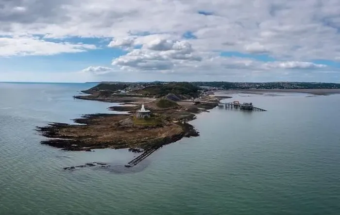Framed Print : aerial view of the Mumbles headland with the historic lighthouse and piers in Swansea Bay Framed Print : aerial view of the Mumbles headland with the historic lighthouse and piers in Swansea Bay