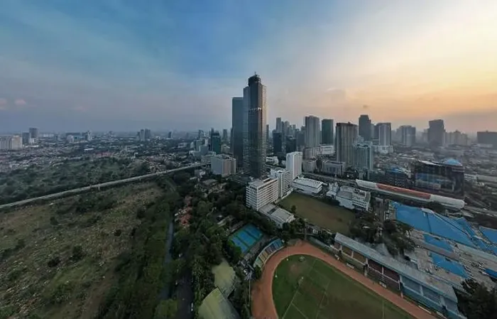 Framed Print : Aerial view of office buildings in Jakarta central business district and noise cloud when sunset Framed Print : Aerial view of office buildings in Jakarta central business district and noise cloud when sunset
