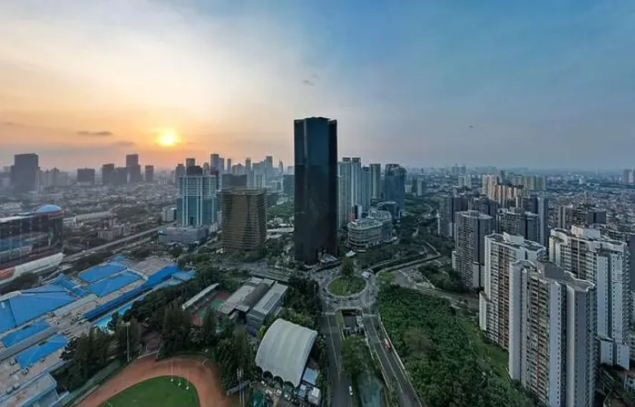 Framed Print : Aerial view of office buildings in Jakarta central business district and noise cloud when sunset Framed Print : Aerial view of office buildings in Jakarta central business district and noise cloud when sunset