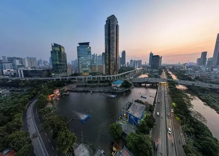 Framed Print : Aerial view of office buildings in Jakarta central business district and noise cloud when sunset Framed Print : Aerial view of office buildings in Jakarta central business district and noise cloud when sunset