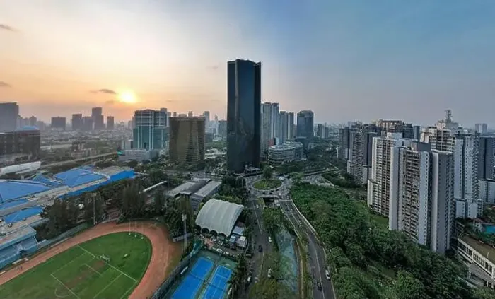 Framed Print : Aerial view of office buildings in Jakarta central business district and noise cloud when sunset Framed Print : Aerial view of office buildings in Jakarta central business district and noise cloud when sunset