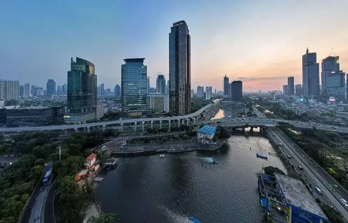 Framed Print : Aerial view of office buildings in Jakarta central business district and noise cloud when sunset Framed Print : Aerial view of office buildings in Jakarta central business district and noise cloud when sunset