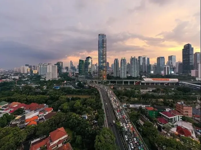 Framed Print : Aerial view of office buildings in Jakarta central business district and noise cloud when sunset Framed Print : Aerial view of office buildings in Jakarta central business district and noise cloud when sunset