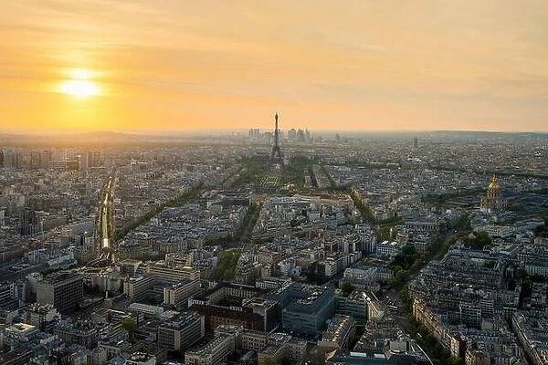 Aerial view of Paris with Eiffel tower at sunset in Paris, France. Eiffel tower is international landmark in Paris, France
