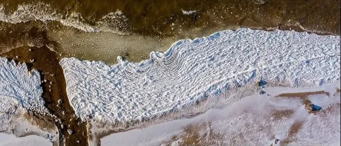 Framed Print : Aerial view over partialy frozen sea with white ice texture Framed Print : Aerial view over partialy frozen sea with white ice texture