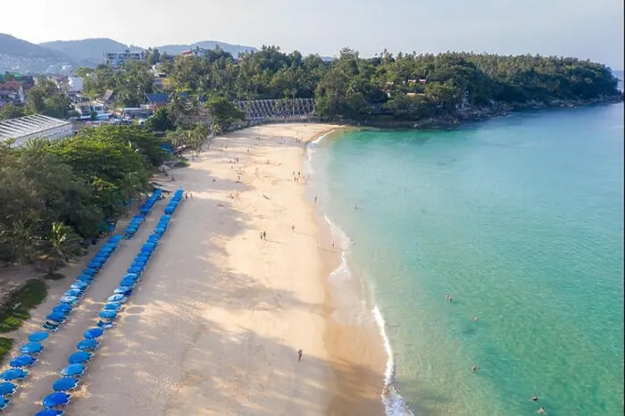 Framed Print : Aerial view of people swimming in the transparent turquoise sea at Karon beach in Phuket, Thailand Framed Print : Aerial view of people swimming in the transparent turquoise sea at Karon beach in Phuket, Thailand