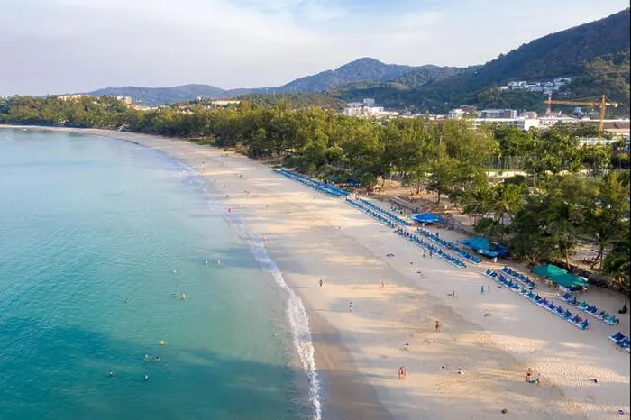 Framed Print : Aerial view of people swimming in the transparent turquoise sea at Karon beach in Phuket, Thailand Framed Print : Aerial view of people swimming in the transparent turquoise sea at Karon beach in Phuket, Thailand