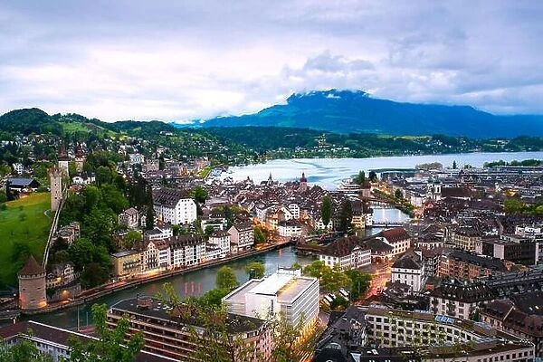 Aerial view of the red tiled roofs of the old town of Lucerne with wooden Chapel bridge in Lucerne, Switzerland
