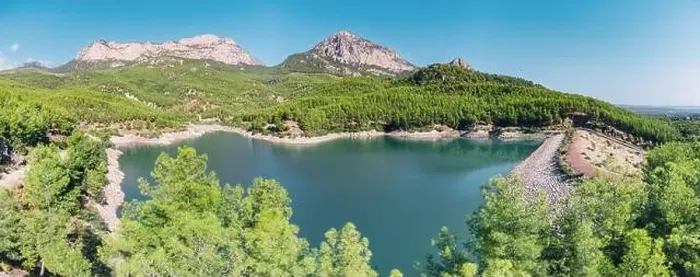Framed Print : Aerial view of the reservoir pond with beautiful bluish green water among the mountains Framed Print : Aerial view of the reservoir pond with beautiful bluish green water among the mountains