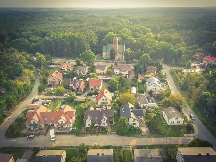 Framed Print : Aerial view of residential houses neighborhood and apartment building complex at sunset Framed Print : Aerial view of residential houses neighborhood and apartment building complex at sunset