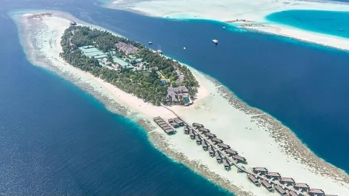 Framed Print : Aerial view of resort water bungalows. Luxury tropical hotel over coral reef connected with atolls in Indian ocean. Amazing travel landscape Framed Print : Aerial view of resort water bungalows. Luxury tropical hotel over coral reef connected with atolls in Indian ocean. Amazing travel landscape