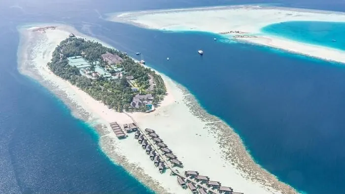 Framed Print : Aerial view of resort water bungalows. Luxury tropical hotel over coral reef connected with atolls in Indian ocean. Amazing travel landscape Framed Print : Aerial view of resort water bungalows. Luxury tropical hotel over coral reef connected with atolls in Indian ocean. Amazing travel landscape