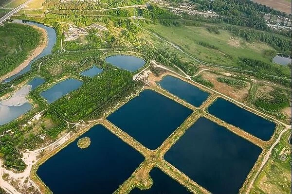 Aerial View Retention Basins, Wet Pond, Wet Detention Basin Or Stormwater Management Pond, Is An Artificial Pond With Vegetation Around The Perimeter