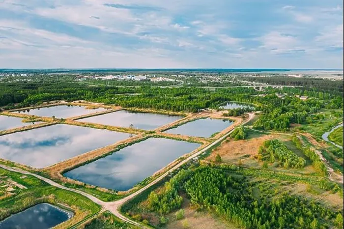Framed Print : Aerial View Retention Basins, Wet Pond, Wet Detention Basin Or Stormwater Management Pond, Is An Artificial Pond With Vegetation Around The Perimeter Framed Print : Aerial View Retention Basins, Wet Pond, Wet Detention Basin Or Stormwater Management Pond, Is An Artificial Pond With Vegetation Around The Perimeter