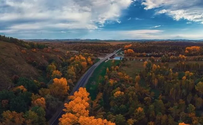 Framed Print : Aerial view of road in beautiful autumn Altai forest Framed Print : Aerial view of road in beautiful autumn Altai forest