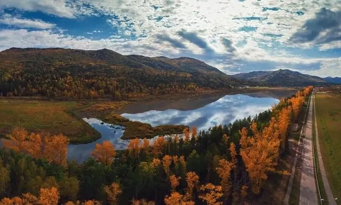 Framed Print : Aerial view of road in beautiful autumn Altai forest Framed Print : Aerial view of road in beautiful autumn Altai forest