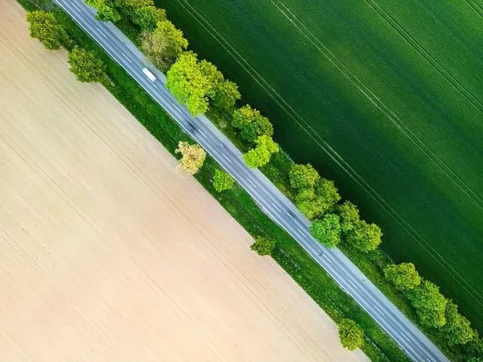 Framed Print : Aerial view of road through fields Framed Print : Aerial view of road through fields