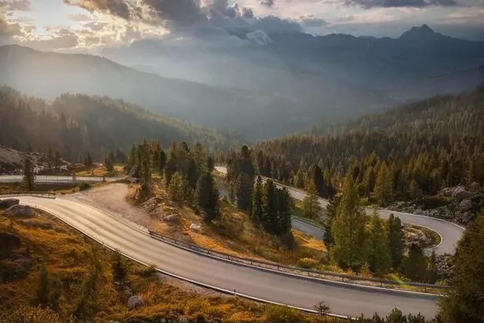 Framed Print : Aerial view of road at sunset in autumn. Drone view of highway in mountains in autumn evening in Italy Framed Print : Aerial view of road at sunset in autumn. Drone view of highway in mountains in autumn evening in Italy