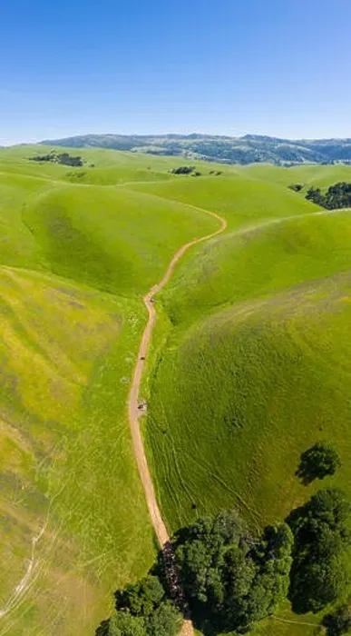 Framed Print : An aerial view of rolling hills in Northern California's tri-valley region shows lush, green grass that flourished after a wet winter Framed Print : An aerial view of rolling hills in Northern California's tri-valley region shows lush, green grass that flourished after a wet winter