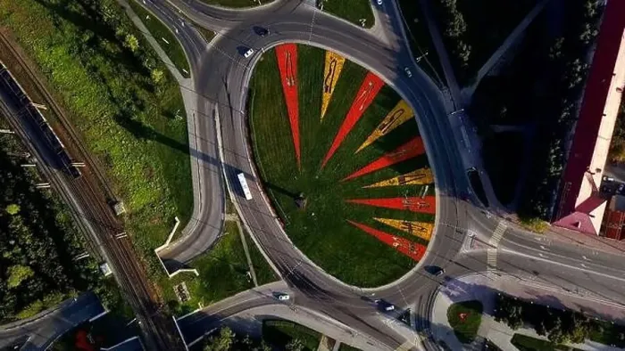 Framed Print : Aerial view of a round shaped crossroad with moving cars Framed Print : Aerial view of a round shaped crossroad with moving cars