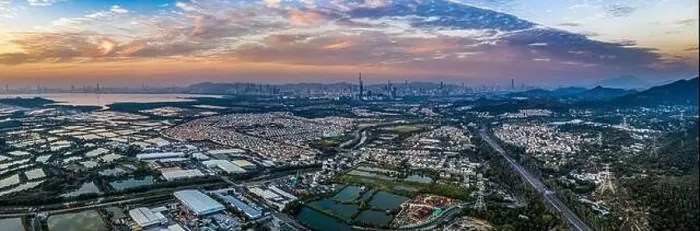 Framed Print : Aerial View of rural green fields in Hong Kong border and skylines in Shenzhen, China Framed Print : Aerial View of rural green fields in Hong Kong border and skylines in Shenzhen, China