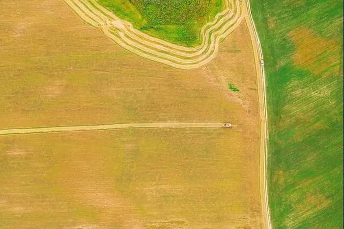 Framed Print : Aerial View Of Rural Landscape. Combine Harvester Working In Field, Collects Seeds. Harvesting Of Wheat In Late Summer. Agricultural Machine Collectin Framed Print : Aerial View Of Rural Landscape. Combine Harvester Working In Field, Collects Seeds. Harvesting Of Wheat In Late Summer. Agricultural Machine Collectin