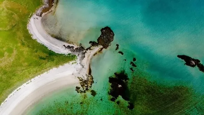 Framed Print : An aerial view of a sandy beach curving into turquoise waters Framed Print : An aerial view of a sandy beach curving into turquoise waters