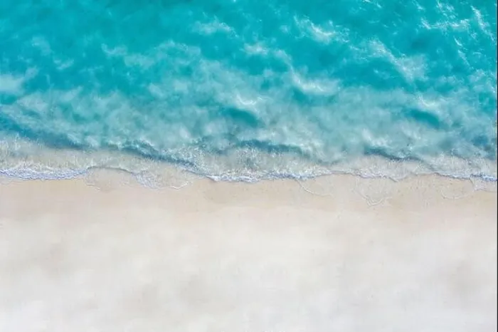 Framed Print : Aerial view of sandy beach and ocean with waves. Summer seascape from air. Top view from drone. Travel concept, Beach and waves from top view Framed Print : Aerial view of sandy beach and ocean with waves. Summer seascape from air. Top view from drone. Travel concept, Beach and waves from top view