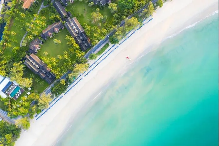 Framed Print : Aerial view of sandy beach with tourists swimming in beautiful clear sea water in Phuket, Thailand Framed Print : Aerial view of sandy beach with tourists swimming in beautiful clear sea water in Phuket, Thailand