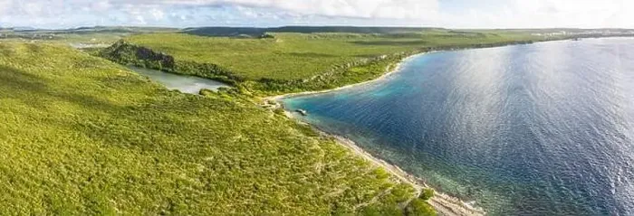 Framed Print : Aerial view above scenery of Curacao, Caribbean with ocean, coast, hills, lake Framed Print : Aerial view above scenery of Curacao, Caribbean with ocean, coast, hills, lake