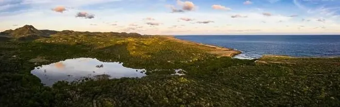 Framed Print : Aerial view above scenery of Curacao, Caribbean with ocean, coast, hills, lake Framed Print : Aerial view above scenery of Curacao, Caribbean with ocean, coast, hills, lake