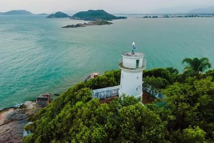 Framed Print : Aerial view of scenic coastline with lighthouse in Santa Catarina, Brazil Framed Print : Aerial view of scenic coastline with lighthouse in Santa Catarina, Brazil