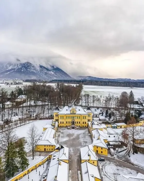 Framed Print : aerial view of Schloss Hellbrunn covered in snow with view of Untersberg near Salzburg Outskirts in winter time Framed Print : aerial view of Schloss Hellbrunn covered in snow with view of Untersberg near Salzburg Outskirts in winter time