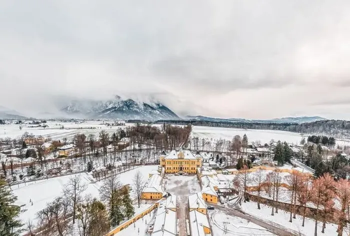 Framed Print : Aerial view of Schloss Hellbrunn covered in snow with view of Untersberg near Salzburg Outskirts in winter time Framed Print : Aerial view of Schloss Hellbrunn covered in snow with view of Untersberg near Salzburg Outskirts in winter time