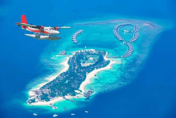 Framed Print : Aerial view of a seaplane approaching island in the Maldives. Maldives beach from birds eye view. Aerial view on Maldives island, atolls and blue sea Framed Print : Aerial view of a seaplane approaching island in the Maldives. Maldives beach from birds eye view. Aerial view on Maldives island, atolls and blue sea
