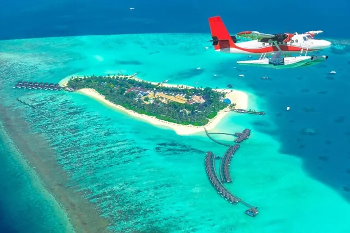 Framed Print : Aerial view of a seaplane approaching island in the Maldives. Maldives beach from birds eye view. Aerial view on Maldives island, atolls and blue sea Framed Print : Aerial view of a seaplane approaching island in the Maldives. Maldives beach from birds eye view. Aerial view on Maldives island, atolls and blue sea