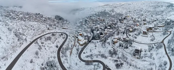 Framed Print : Aerial View of Seli Traditional Greek Village Covered by Snow in Winter Morning Framed Print : Aerial View of Seli Traditional Greek Village Covered by Snow in Winter Morning