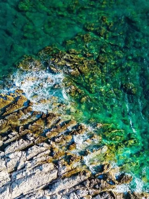 Framed Print : Aerial view of sharp rocks on Punta Planka, Croatia, splashed with waves creating white foam Framed Print : Aerial view of sharp rocks on Punta Planka, Croatia, splashed with waves creating white foam