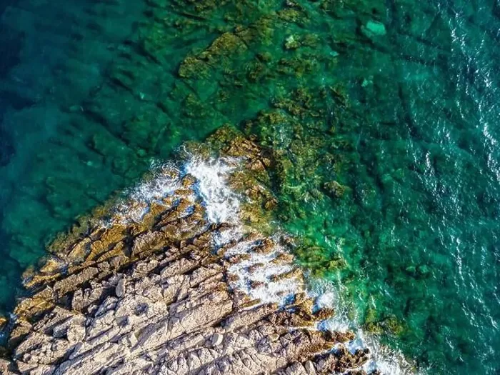 Framed Print : Aerial view of sharp rocks on Punta Planka, Croatia, splashed with waves creating white foam Framed Print : Aerial view of sharp rocks on Punta Planka, Croatia, splashed with waves creating white foam