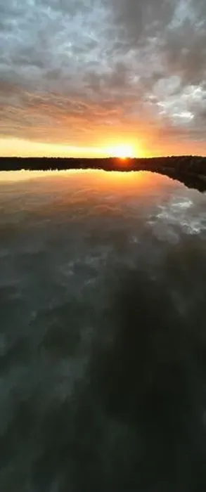 Framed Print : Aerial view, shot by a drone of a sunset at coast of the lake Framed Print : Aerial view, shot by a drone of a sunset at coast of the lake