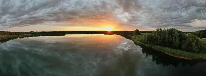 Framed Print : Aerial view, shot by a drone of a sunset at coast of the lake Framed Print : Aerial view, shot by a drone of a sunset at coast of the lake