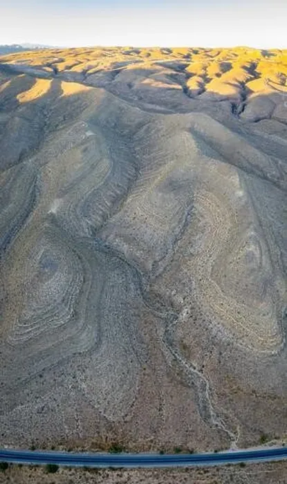 Framed Print : An aerial view shows a rugged mountain landscape that rises from the desert surrounding Las Vegas, Nevada. This dry area averages over 95 degrees F Framed Print : An aerial view shows a rugged mountain landscape that rises from the desert surrounding Las Vegas, Nevada. This dry area averages over 95 degrees F