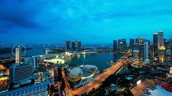 Aerial view of Singapore business district and city at night in Singapore, Asia