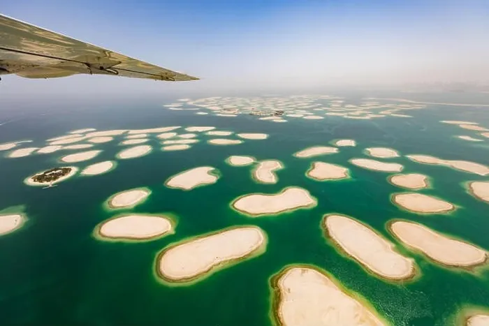Framed Print : Aerial view from small airplane window, artificial palm island in Dubai. Panoramic view Framed Print : Aerial view from small airplane window, artificial palm island in Dubai. Panoramic view
